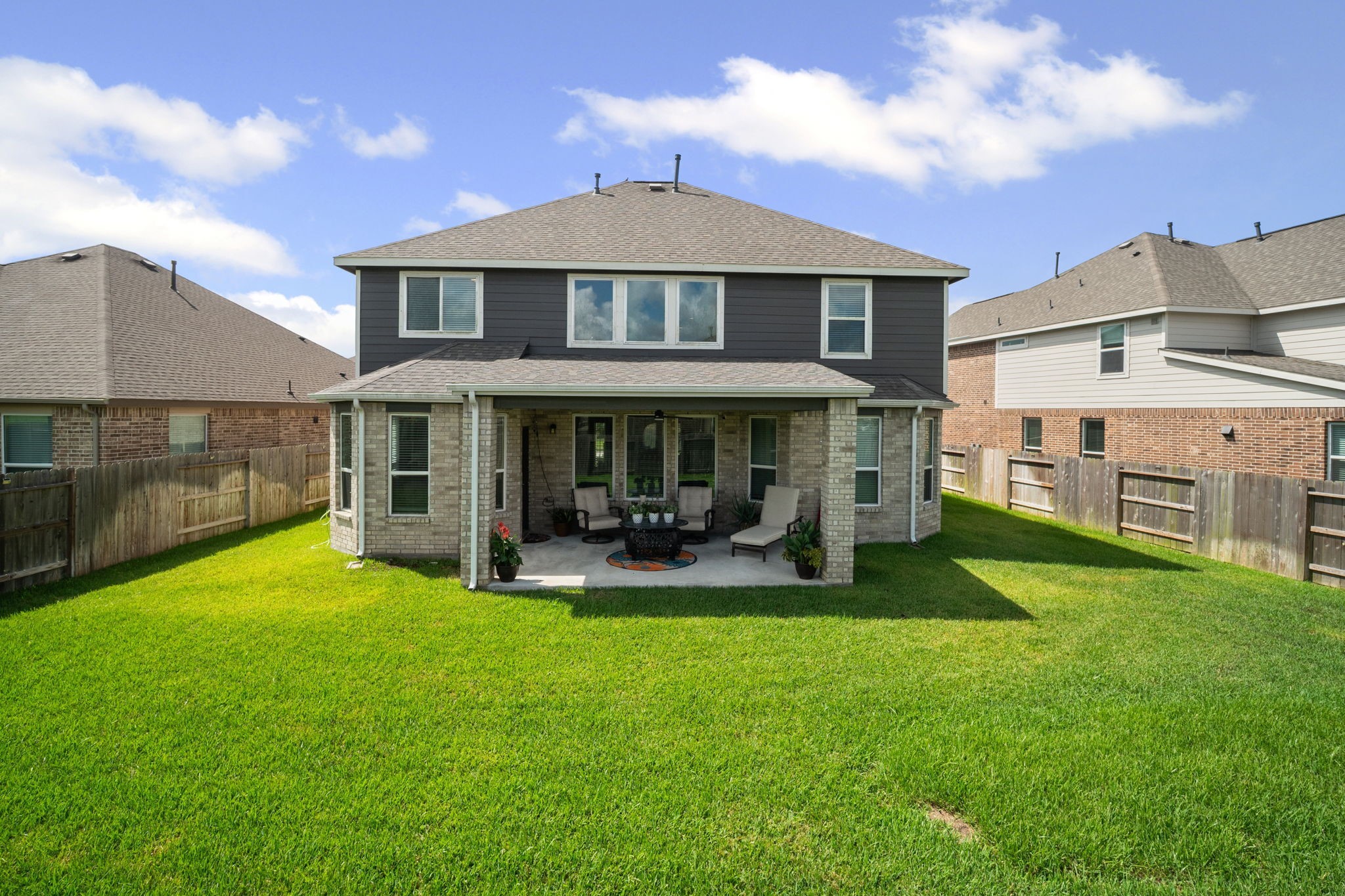82 Indian Wells Drive Manvel, TX 77578 - Photo 26 of 30 a front view of a house with a yard table and chairs