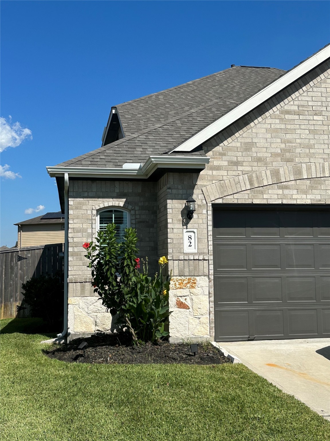 82 Indian Wells Drive Manvel, TX 77578 - Photo 4 of 30 a front view of a house with a garden