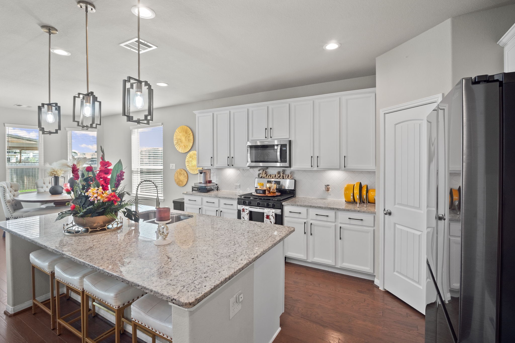 82 Indian Wells Drive Manvel, TX 77578 - Photo 9 of 30 a kitchen with sink cabinets and window