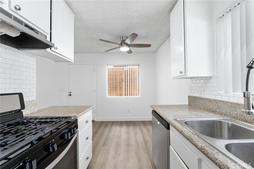 223 Shell Street Manhattan Beach, CA 90266 - Photo 20 of 50 a kitchen that has a sink and a stove