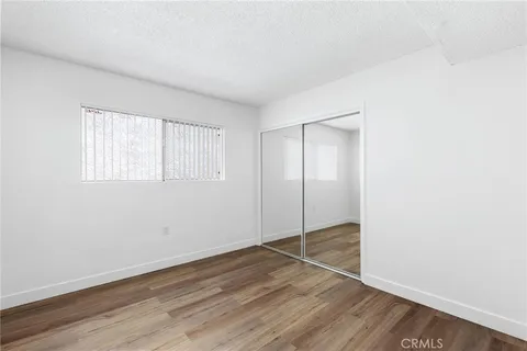 an empty room with wooden floor