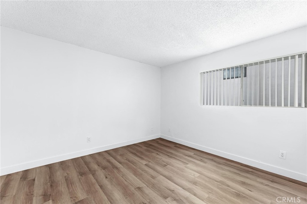 223 Shell Street Manhattan Beach, CA 90266 - Photo 23 of 50 an empty room with wooden floor