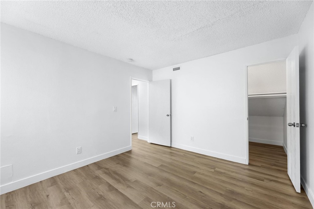 223 Shell Street Manhattan Beach, CA 90266 - Photo 24 of 50 a view of an empty room with wooden floor