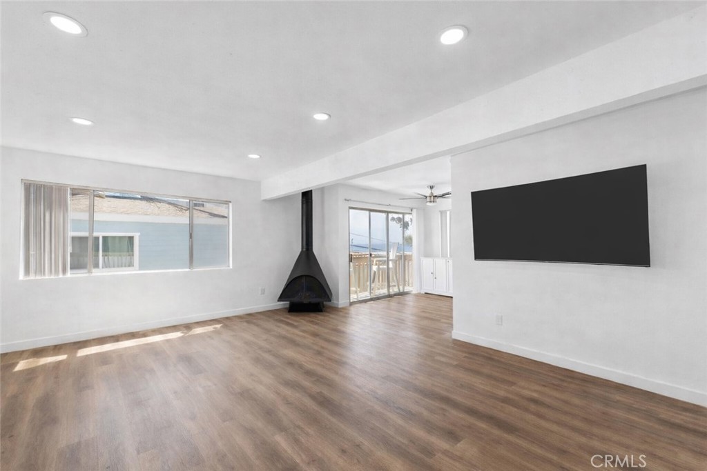 223 Shell Street Manhattan Beach, CA 90266 - Photo 31 of 50 a view of an empty room with wooden floor and a window