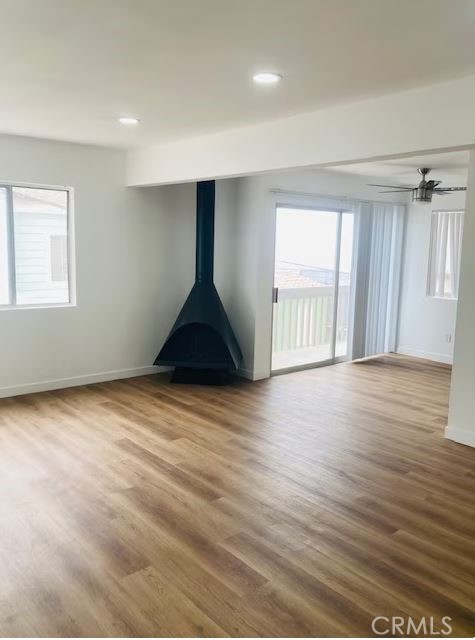 223 Shell Street Manhattan Beach, CA 90266 - Photo 32 of 50 an empty room with wooden floor and windows