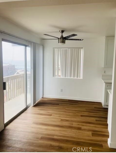 223 Shell Street Manhattan Beach, CA 90266 - Photo 33 of 50 a view of an empty room with a window and wooden floor