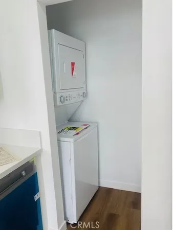 a living room with furniture and a ceiling fan