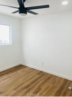 a bathroom with a double vanity sink and a large mirror