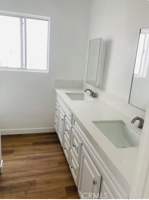 223 Shell Street Manhattan Beach, CA 90266 - Photo 47 of 50 a bathroom with a double vanity sink and a large mirror
