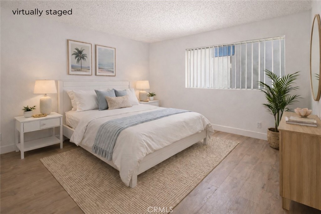 223 Shell Street Manhattan Beach, CA 90266 - Photo 10 of 50 a bedroom with a bed and window