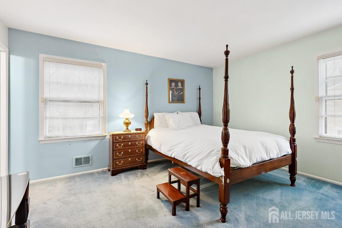 18 Rachele Court Old Bridge, NJ 07747 - Photo 11 of 22 a bed sitting in a bedroom next to a window