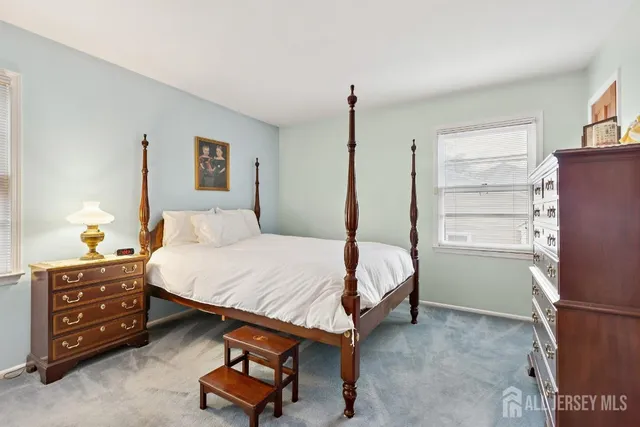 a bedroom with a bed and a cabinets