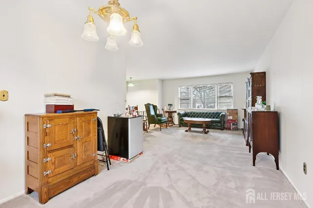 a view of a livingroom with furniture and windows