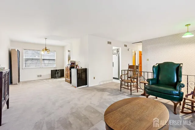 a living room with furniture and a table