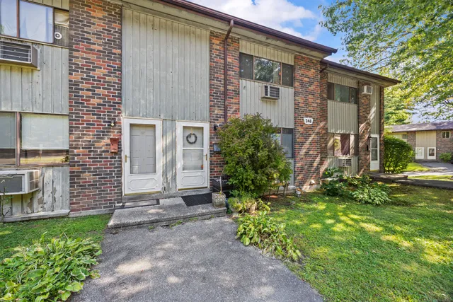 a front view of a house with garden