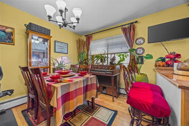 a dining room with furniture and a chandelier