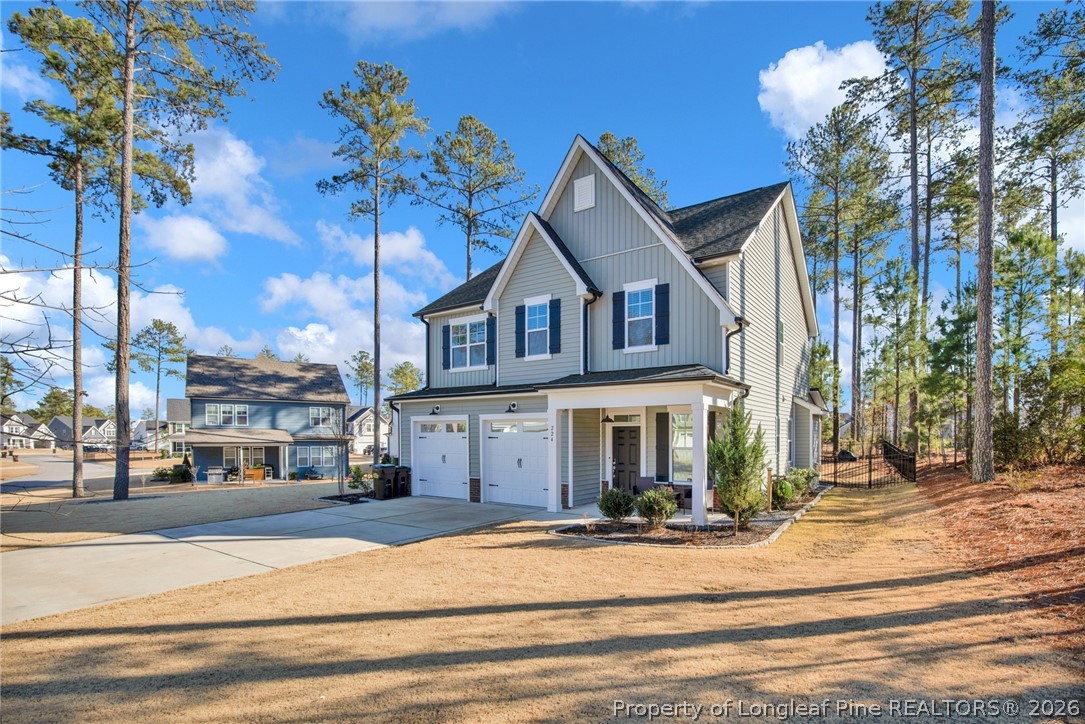 224 Timber Skip Drive Spring Lake, NC 28390 - Photo 3 of 30 a front view of a house with a garden