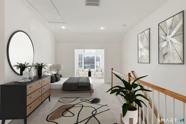 a living room with furniture a chandelier and a potted plant