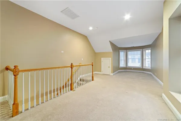 a view of a hallway with windows