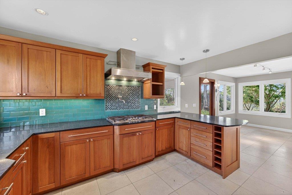 505 Hidden Valley Road Watsonville, CA 95076 - Photo 13 of 72 a kitchen with stainless steel appliances granite countertop a sink and cabinets
