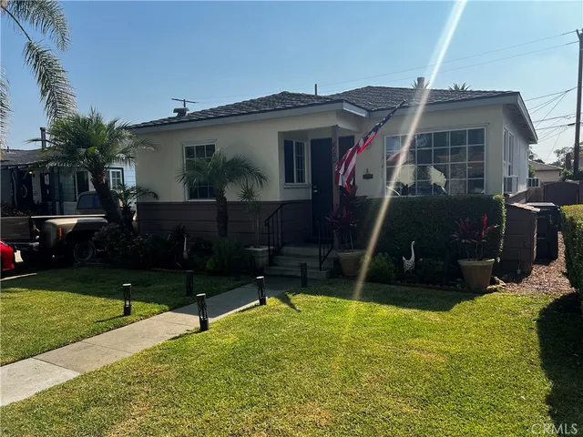 a view of house with yard