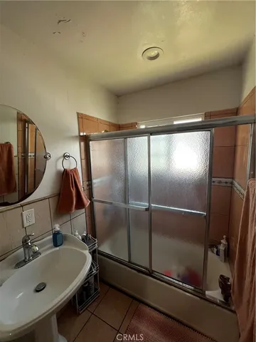 a bathroom with a sink and mirror