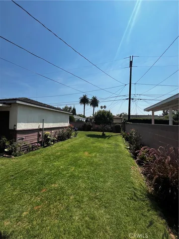 a view of a couches in backyard of house