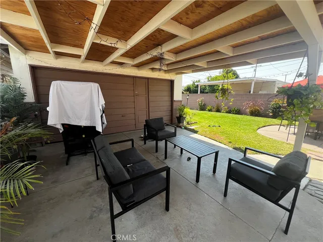 a sitting area with furniture and a yard