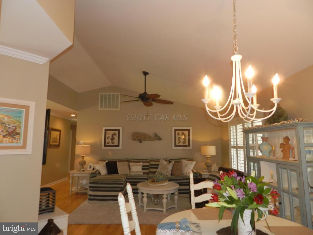 15 Mist Flower Road Berlin, MD 21811 - Photo 14 of 49 a living room with furniture a chandelier and a window