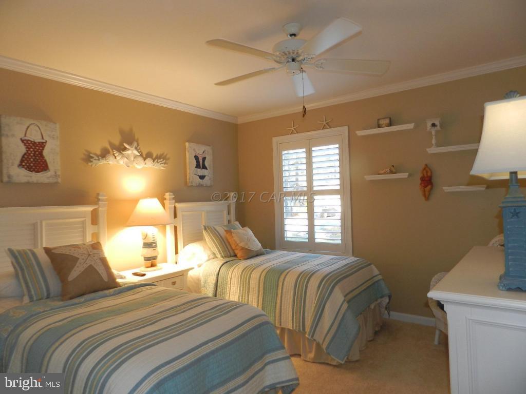 15 Mist Flower Road Berlin, MD 21811 - Photo 6 of 49 a bedroom with a bed and a window