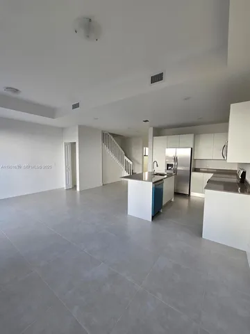 a view of a kitchen with furniture and a kitchen