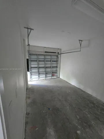 a view of an empty room with a fireplace