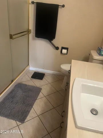 a bathroom with a toilet and a tub