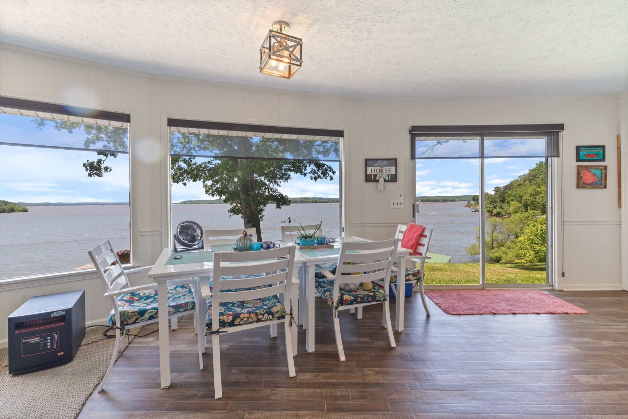440 Bluff Point Lane Waverly, TN 37185 - Photo 13 of 97 a view of a dining room and livingroom with furniture window and wooden floor