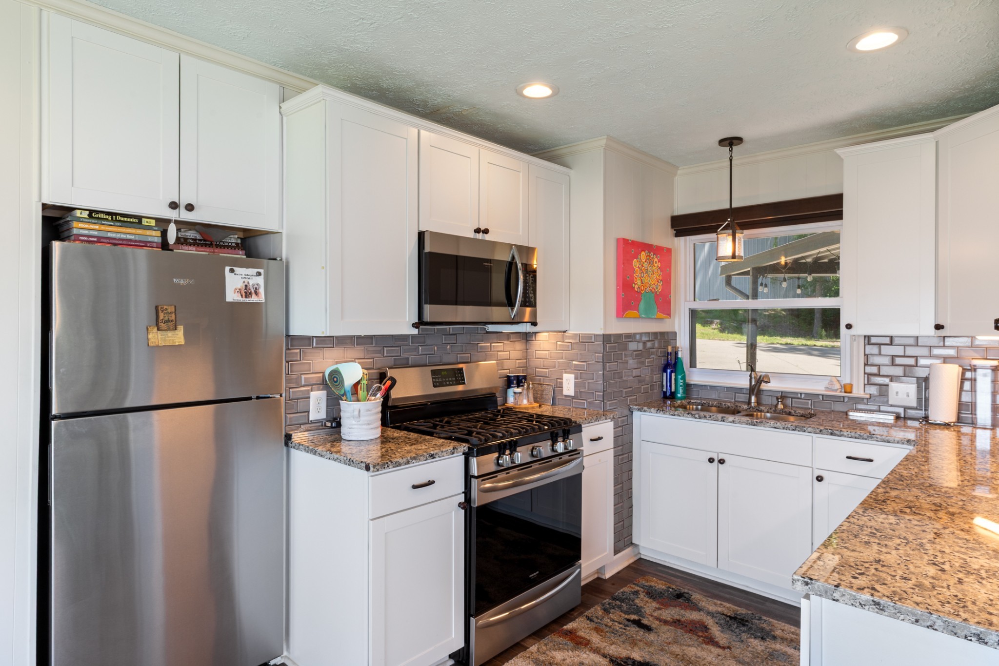 440 Bluff Point Lane Waverly, TN 37185 - Photo 15 of 97 a kitchen with stainless steel appliances a refrigerator sink and microwave