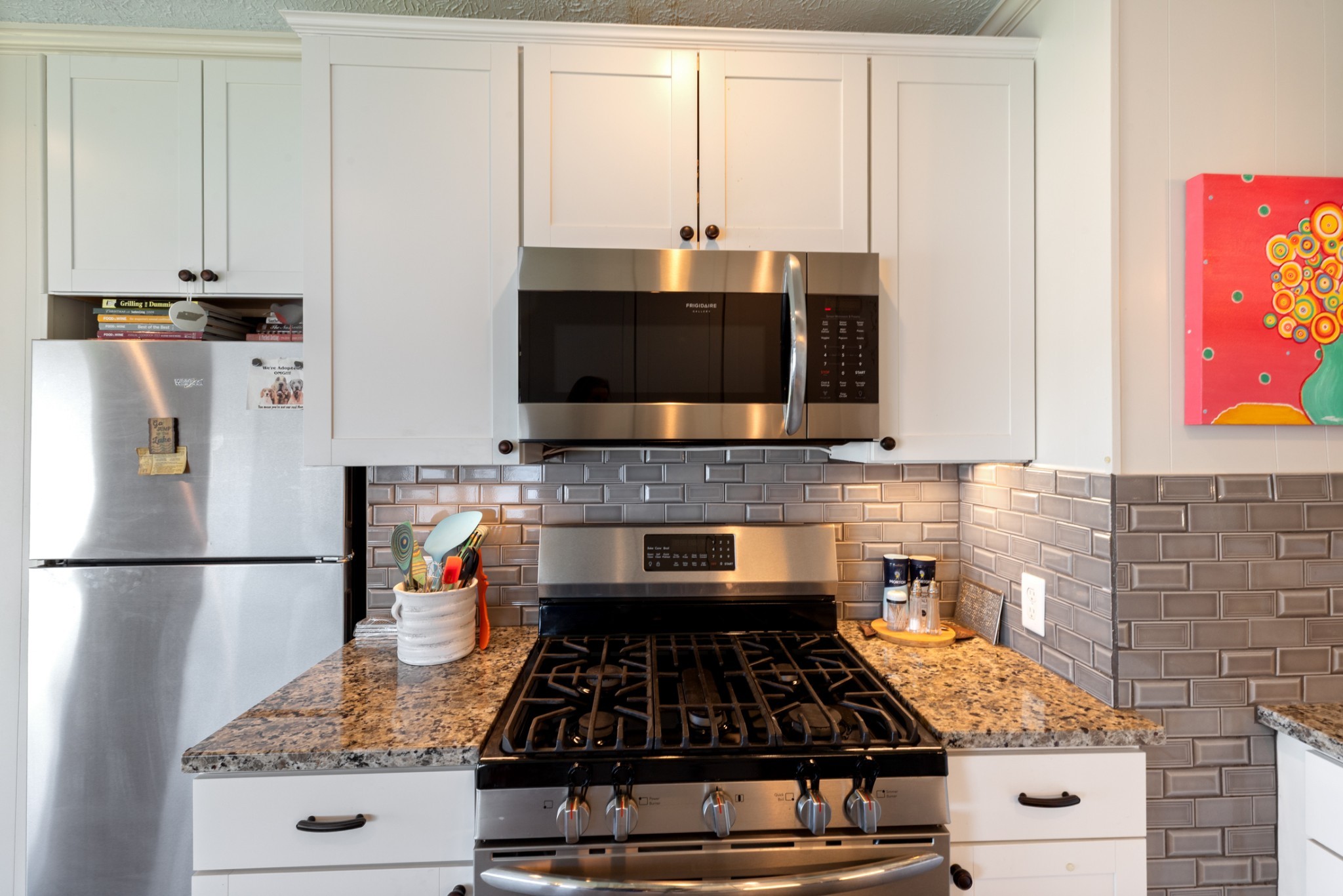 440 Bluff Point Lane Waverly, TN 37185 - Photo 16 of 97 a kitchen with stainless steel appliances granite countertop a stove and a refrigerator