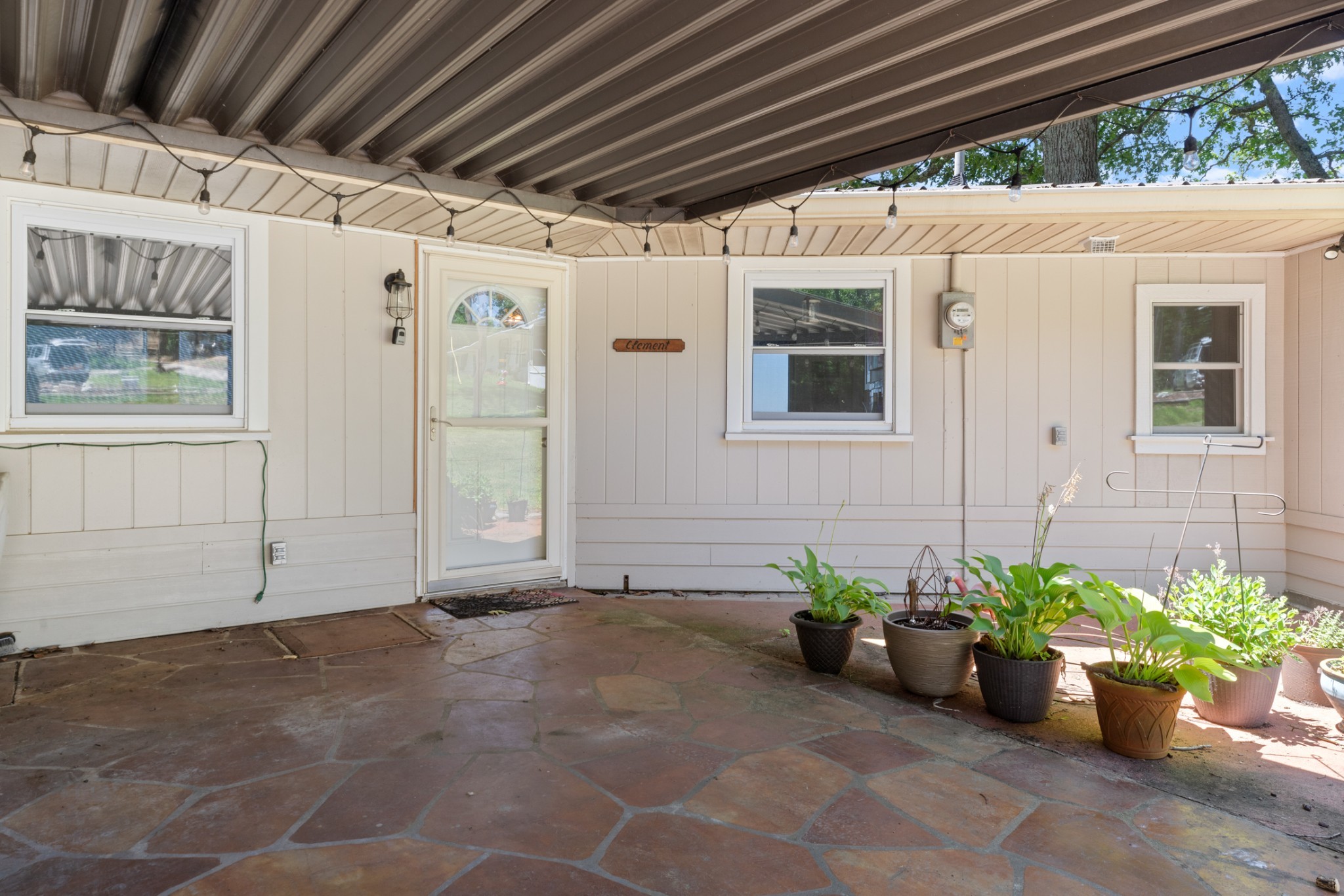 440 Bluff Point Lane Waverly, TN 37185 - Photo 34 of 97 a view of a porch with a table and chair and potted plants