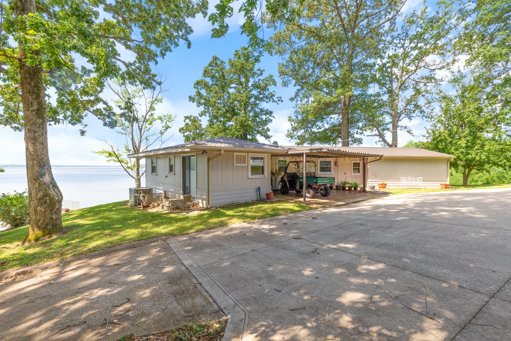 440 Bluff Point Lane Waverly, TN 37185 - Photo 4 of 97 a view of a house with backyard and a tree