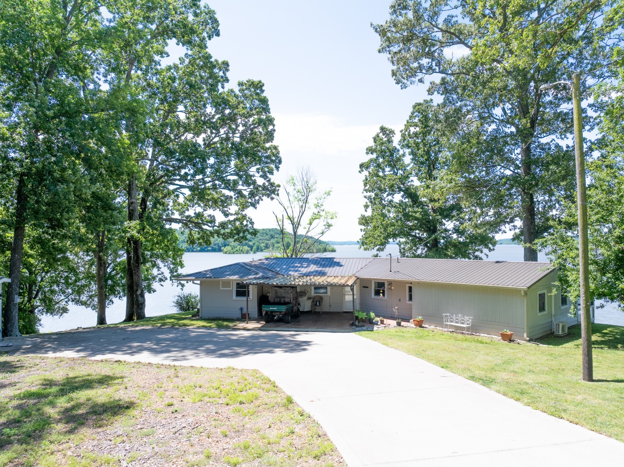 440 Bluff Point Lane Waverly, TN 37185 - Photo 42 of 97 a front view of a house with a yard and a porch
