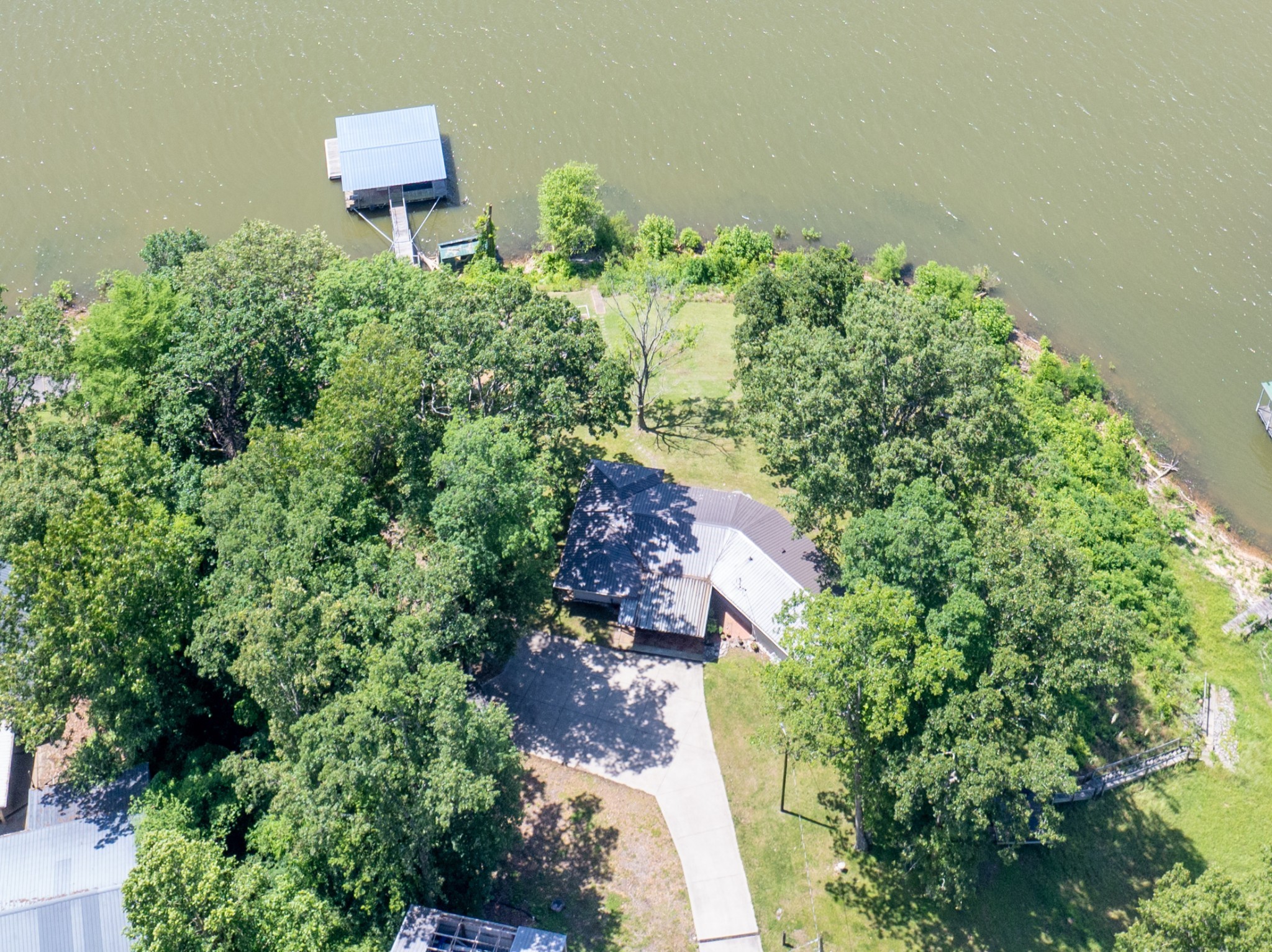 440 Bluff Point Lane Waverly, TN 37185 - Photo 45 of 97 an aerial view of a house with a yard and garden