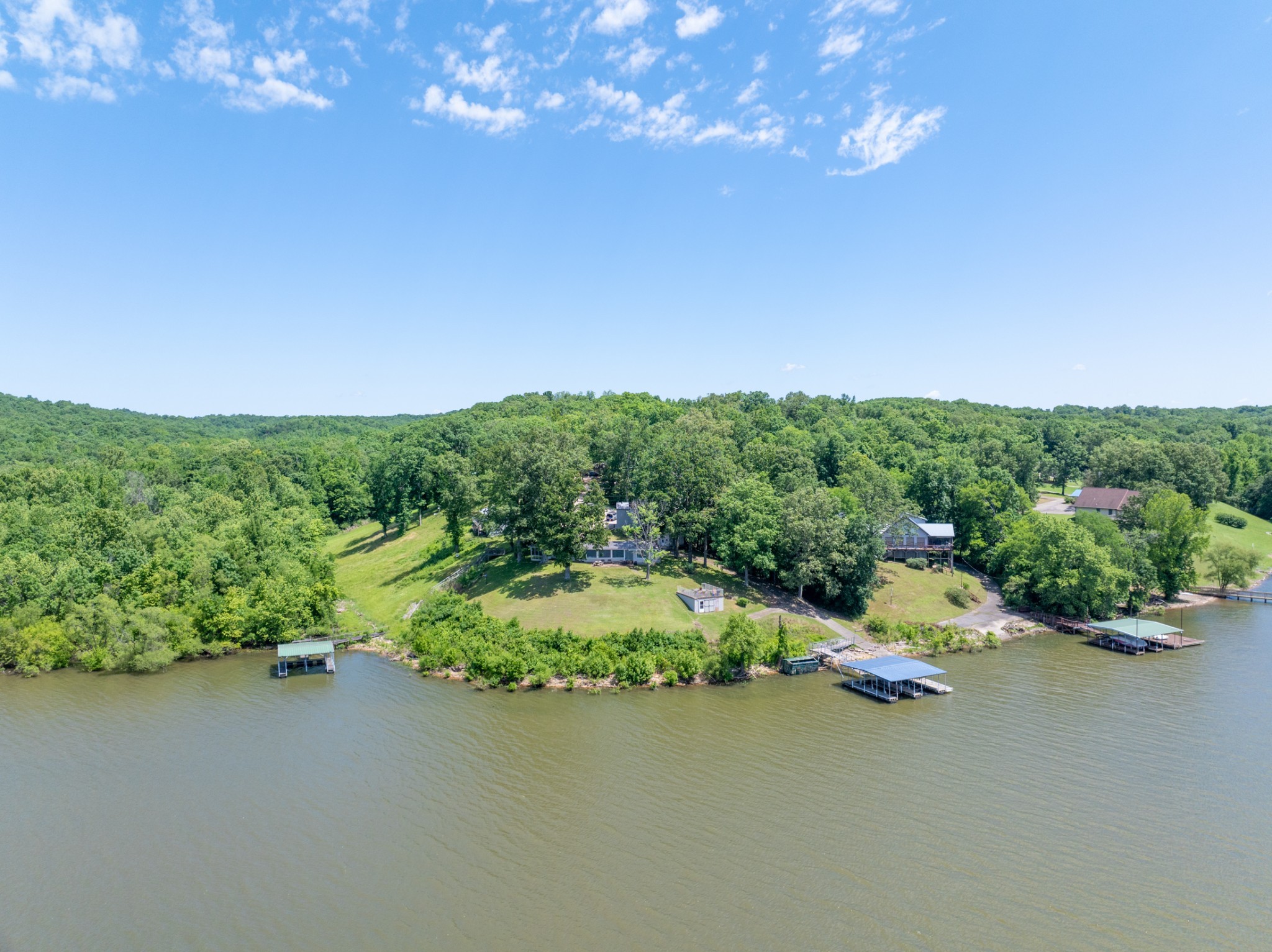 440 Bluff Point Lane Waverly, TN 37185 - Photo 55 of 97 an aerial view of a house with a yard basket ball court and outdoor seating