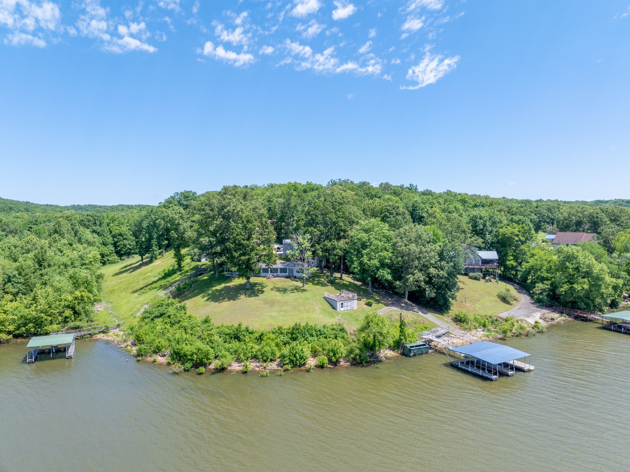 440 Bluff Point Lane Waverly, TN 37185 - Photo 56 of 97 an aerial view of a house with a yard basket ball court and outdoor seating