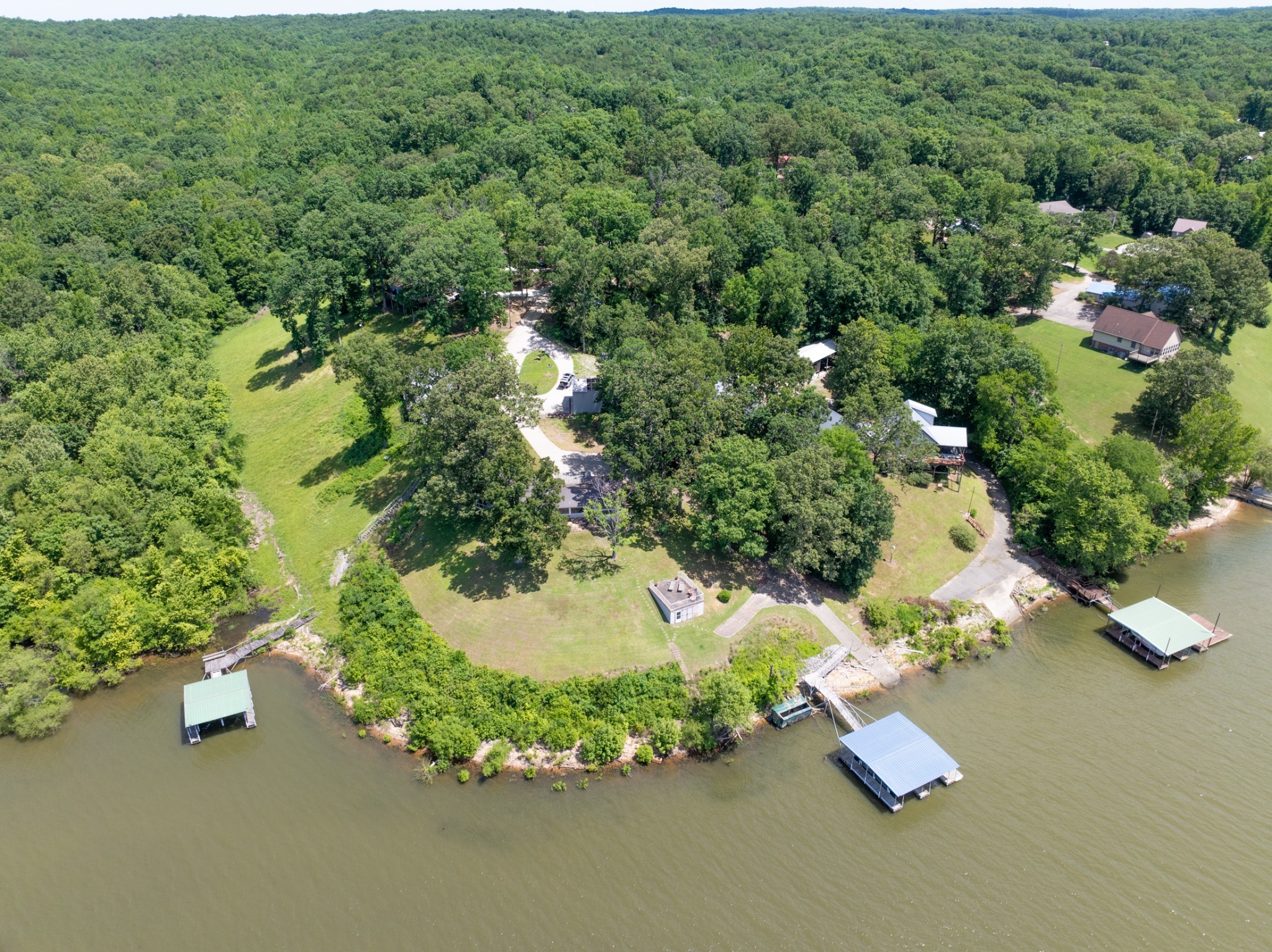 440 Bluff Point Lane Waverly, TN 37185 - Photo 57 of 97 an aerial view of a house with a yard and lake view