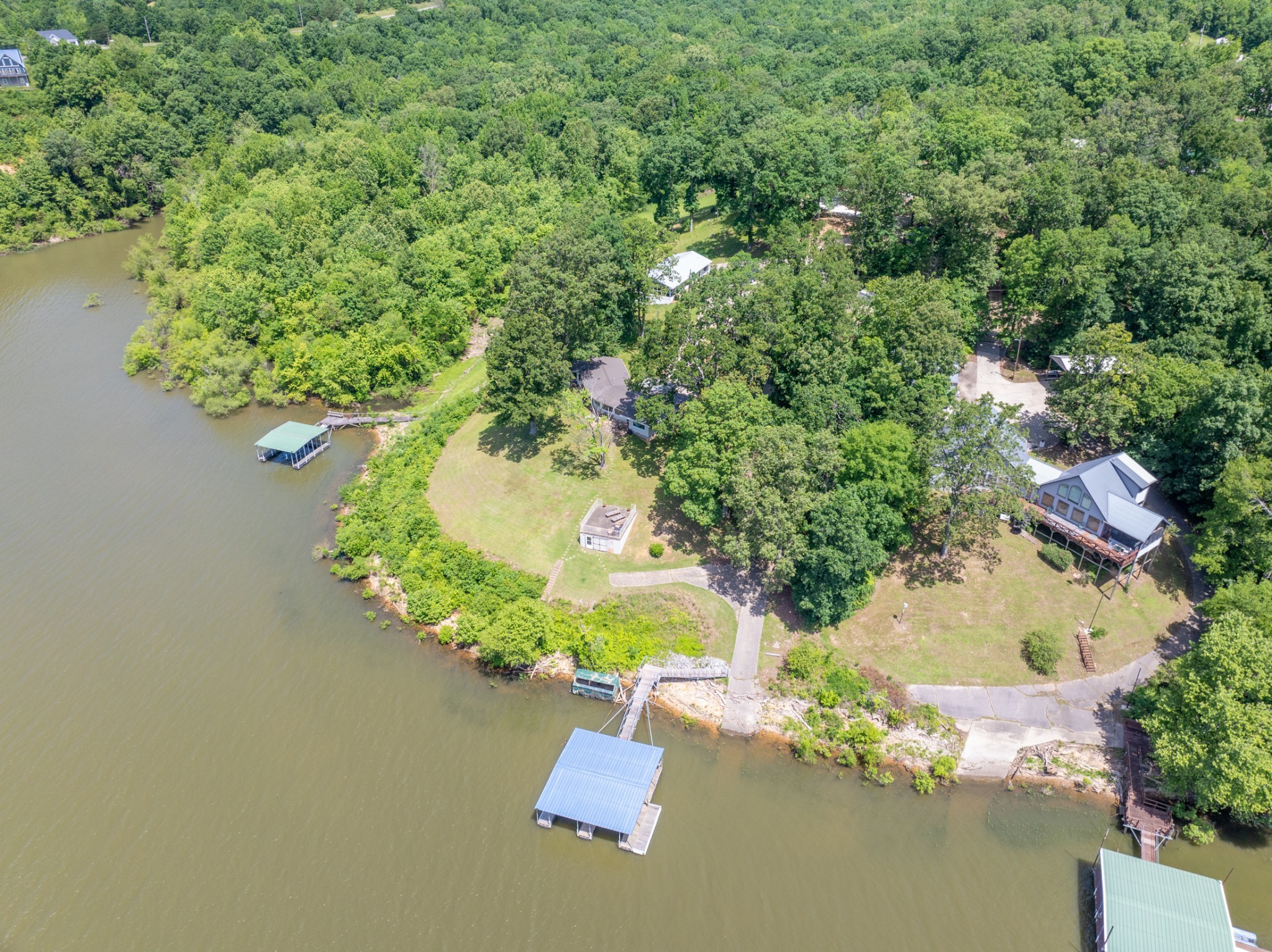 440 Bluff Point Lane Waverly, TN 37185 - Photo 60 of 97 an aerial view of a house with yard and swimming pool