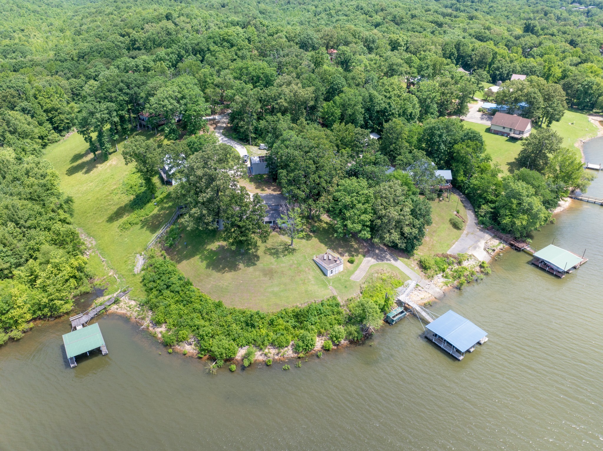 440 Bluff Point Lane Waverly, TN 37185 - Photo 61 of 97 an aerial view of a house with a yard and lake view