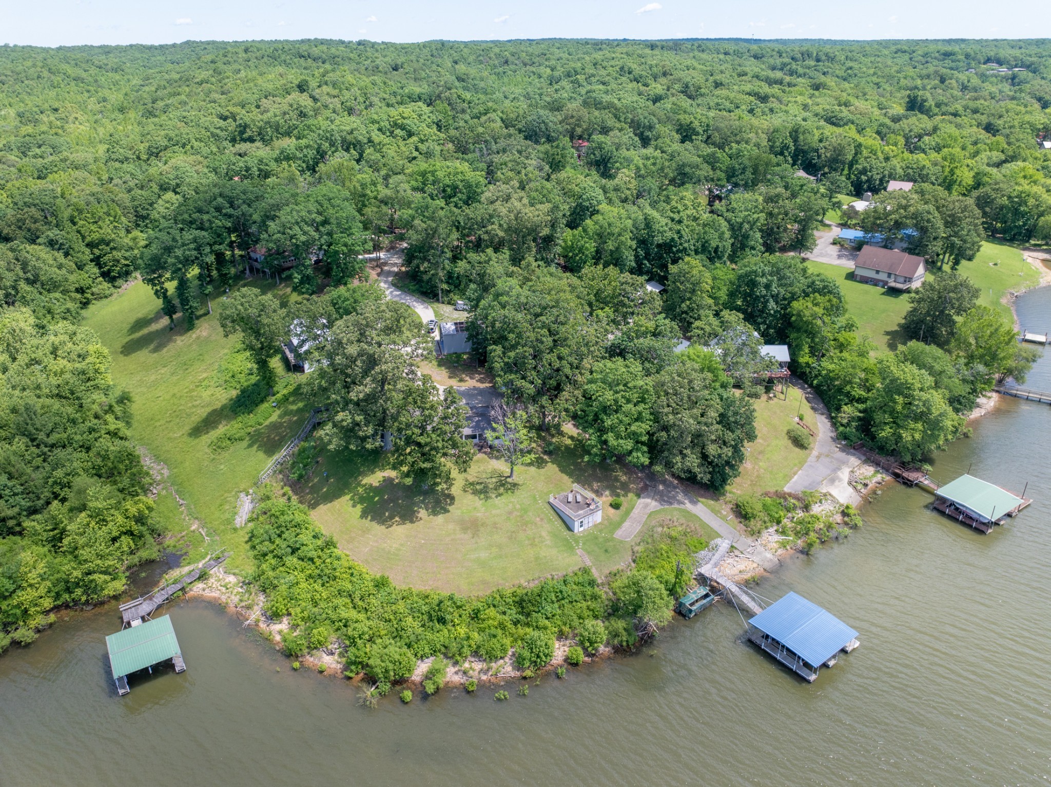 440 Bluff Point Lane Waverly, TN 37185 - Photo 62 of 97 an aerial view of a house with a yard and lake view