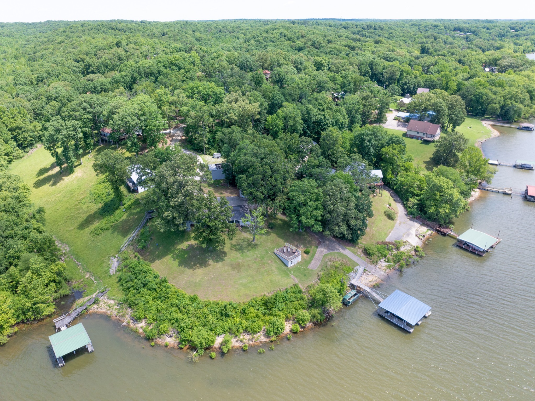 440 Bluff Point Lane Waverly, TN 37185 - Photo 63 of 97 an aerial view of a house with a yard and lake view