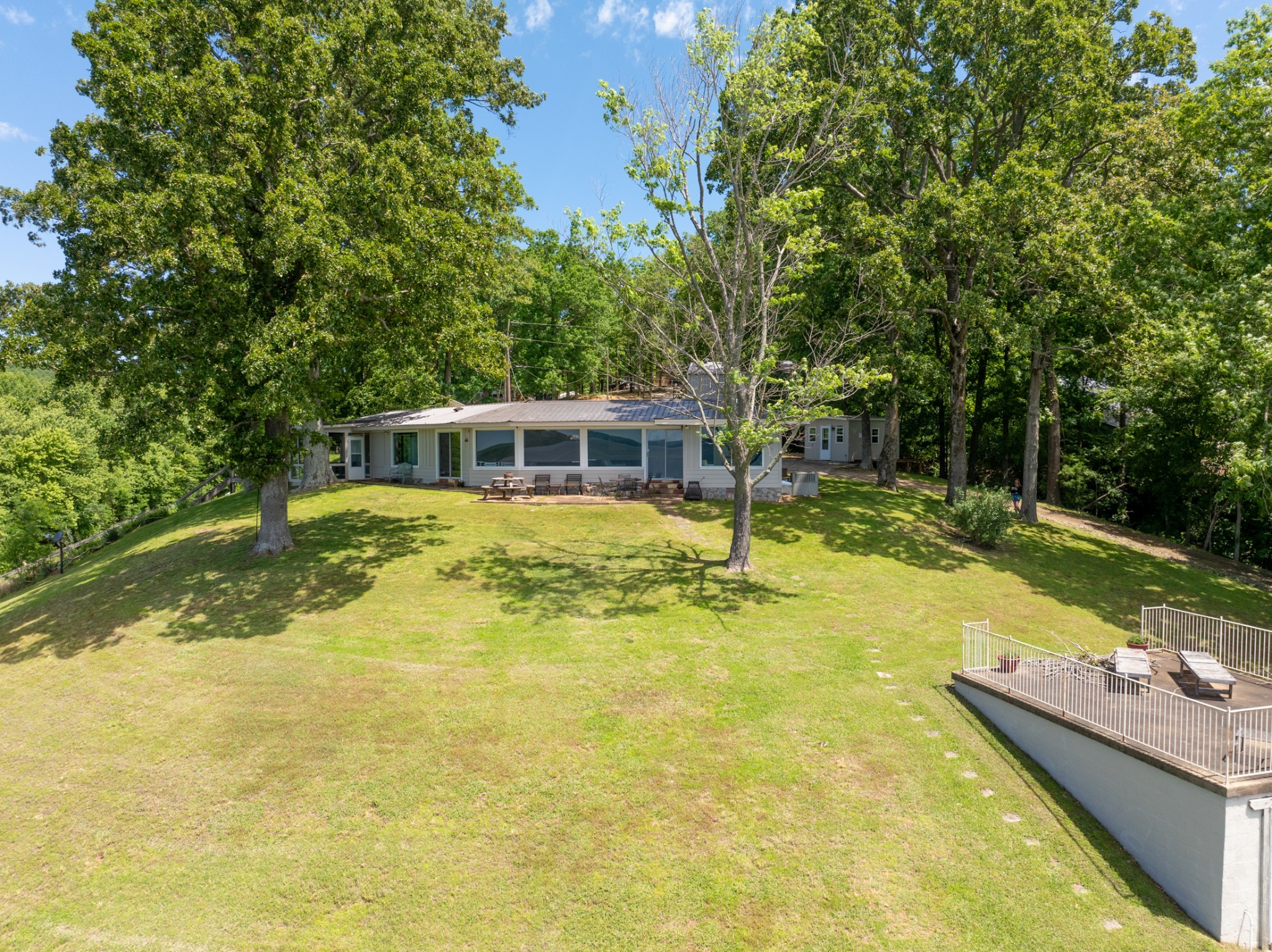 440 Bluff Point Lane Waverly, TN 37185 - Photo 77 of 97 a view of a house with swimming pool and a yard