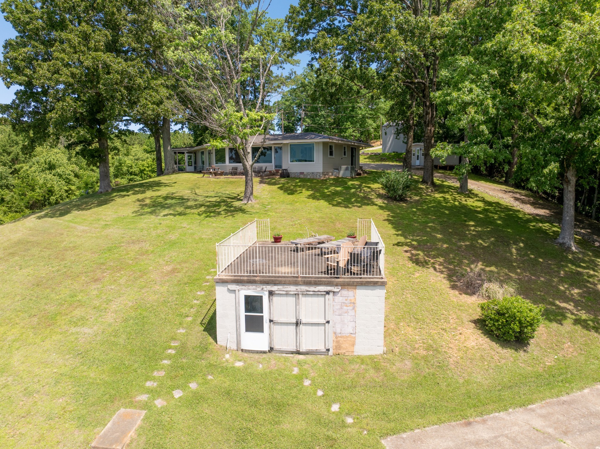 440 Bluff Point Lane Waverly, TN 37185 - Photo 80 of 97 a view of a house with swimming pool and sitting area