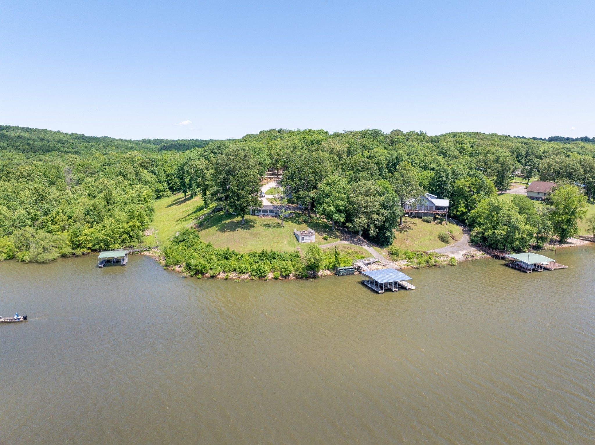 440 Bluff Point Lane Waverly, TN 37185 - Photo 95 of 97 an aerial view of a house with a yard and lake view